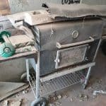 Old outdoor BBQ grill ready for disposal