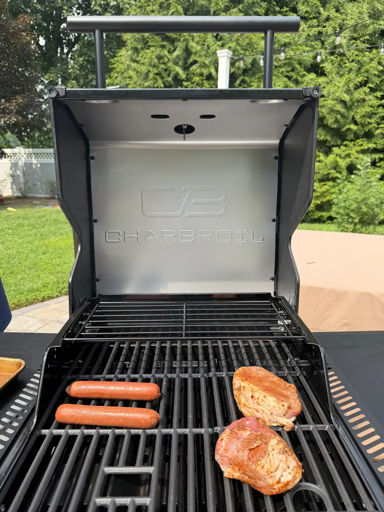 Gas grill heating to its normal cooking temperature